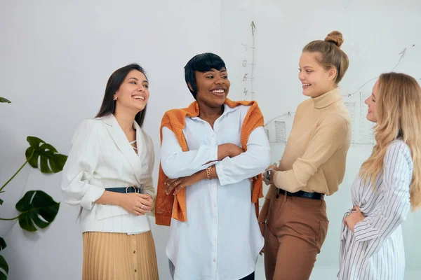Cheerful business team of four diverse women — ストック写真