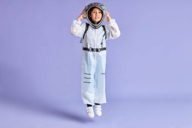 Caucasian spaceman kid in jump clipart