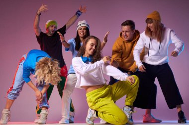 Group of young hip-hop dancers in studio clipart