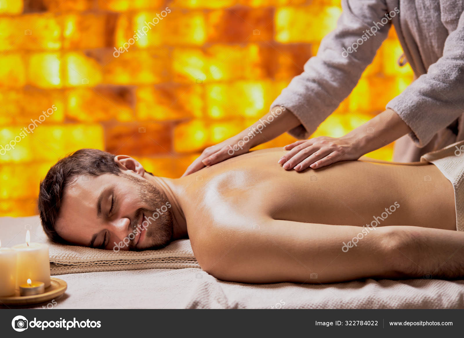Caucasian young man getting massage in beauty salon Stock Photo by  ©ufabizphoto 322784022