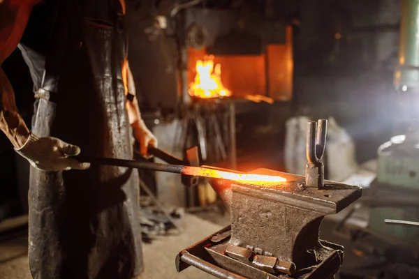 Shaping red hot metal in workshop — Stock Photo, Image