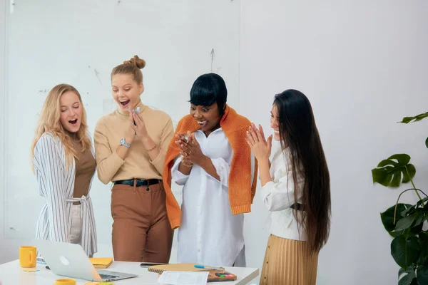 Happy surprised four business people in shock — Stock Photo, Image