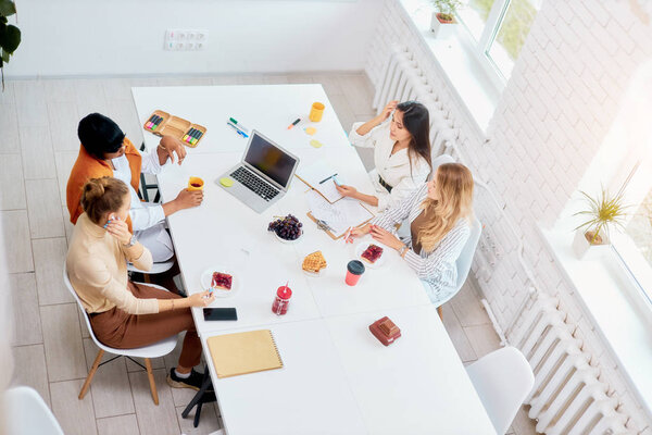 multi-ethnic group of business people working on laptop