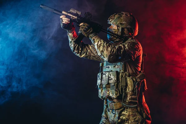 Militant soldier man in smoky UV space — Stock Photo, Image