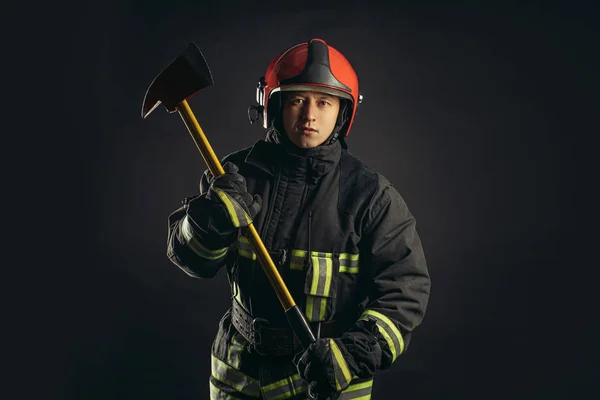 handsome strong fireman with hammer