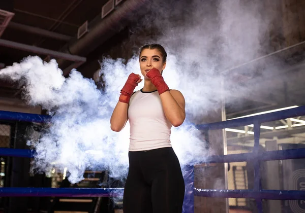 Young fit female training, boxing in ring — 스톡 사진