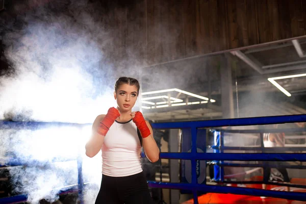 Young fit female training, boxing in ring — 스톡 사진