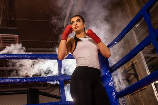 Professional female fighter in ring