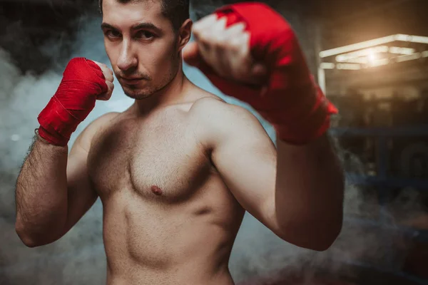 Portrait of muscular strong boxer man in smoke — Stock Photo, Image