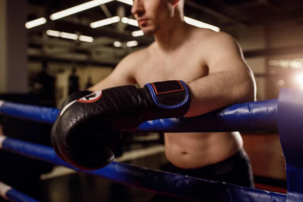 cropped naked boxer man in boxer gloves