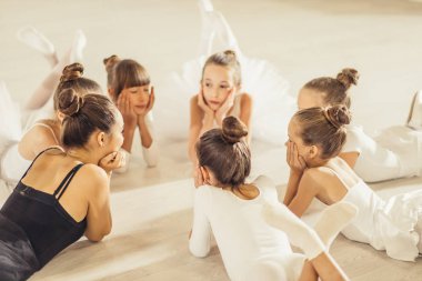 young woman lying on floor with kids