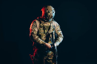 young military man in helmet isolated in UV background