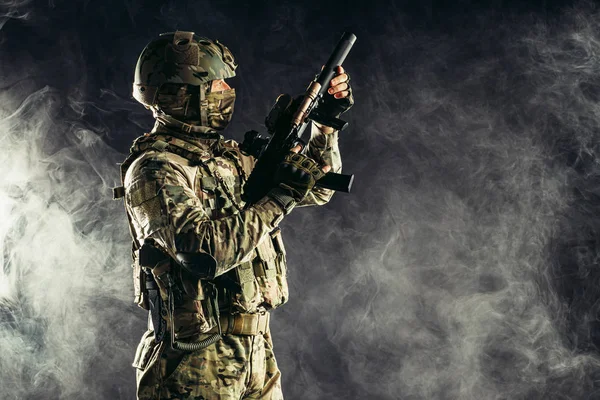 Military service conept. caucasian man aiming rifle — Stok fotoğraf