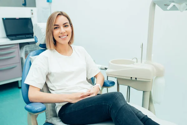 Young charming lady sit in dentist office — Stockfoto