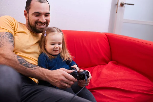 happy caucasian daughter and father play video games