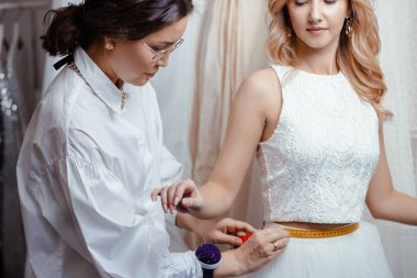 romantic bride in designers wedding salon clipart