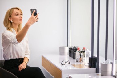 Spare time of make-up artist at her work place