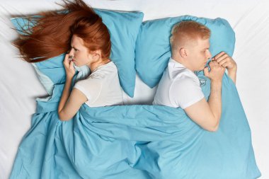 young unhappy angry couple having marital problems