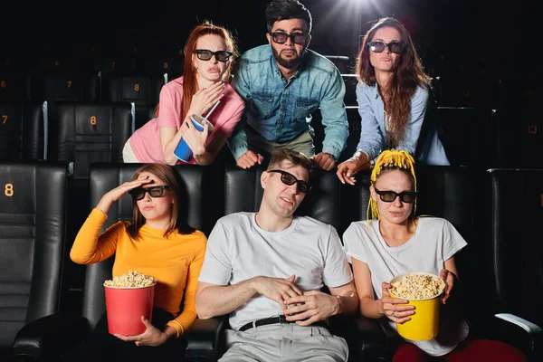 Surprised irritated terrified men and women watching movie — 스톡 사진