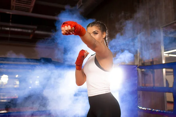 Young fit female training, boxing in ring — 스톡 사진