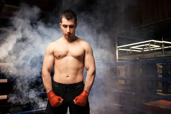 Portrait of muscular strong boxer man in smoke — Stock Photo, Image