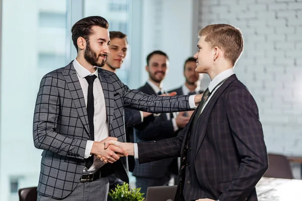 young caucasian boss congratulate best worker of company