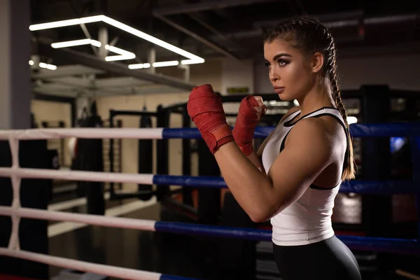 Muscular woman boxer isolated in gym — 스톡 사진