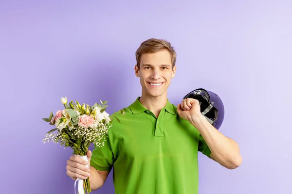Young caucasian man courier of flowers — 스톡 사진