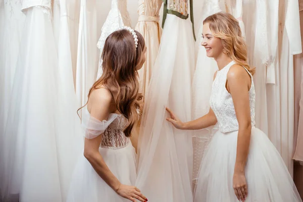 Two young women choosing dress for wedding — 스톡 사진