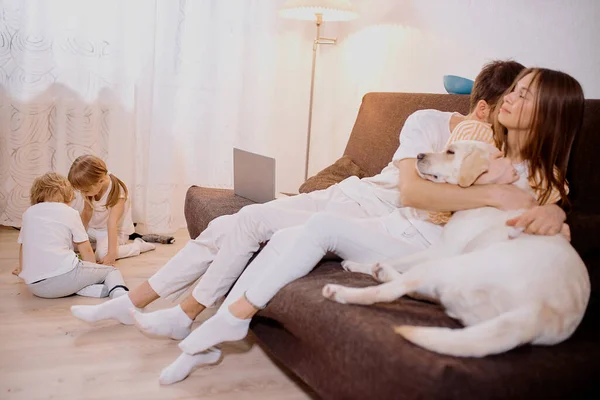 Lovely cute couple and kids at home together — ストック写真