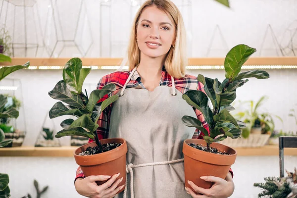 good-looking lady with plants in pot