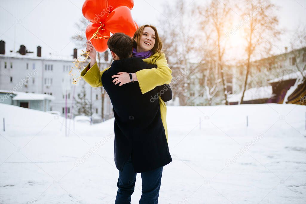 happy couple spend time together, celebrate st valentines day in winter street