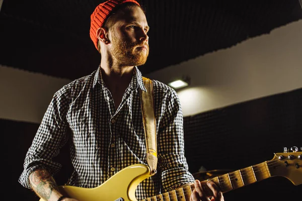 talented musician play on electric guitar his favourite song