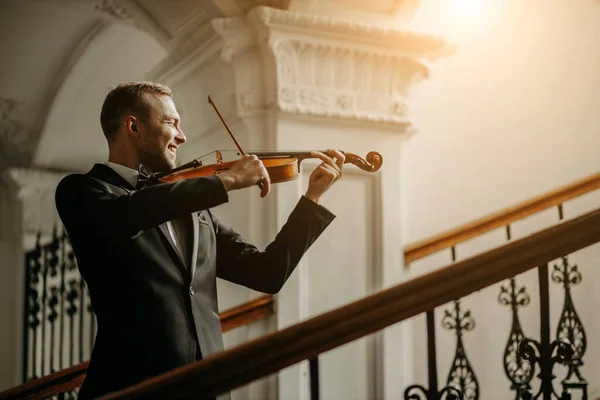 talented professional violinist play in the hall