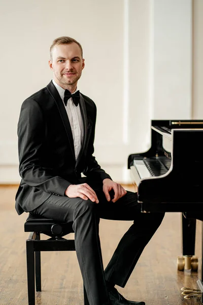professional pianist man sit posing at camera