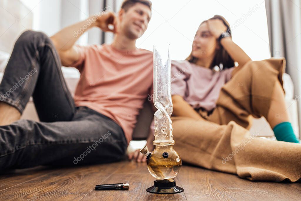 young man and woman relax after taking drugs