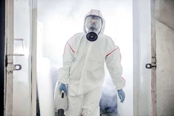 Disinfector use special isinfectant sprayers and germs during coronavirus pandemic epidemic — Stock Photo, Image