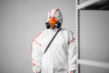 disinfector wearing protective biological suit and gas-mask conduct disinfection clipart