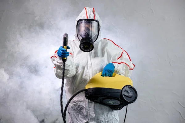 Disinfector use special isinfectant sprayers and germs during coronavirus pandemic epidemic — Stock Photo, Image