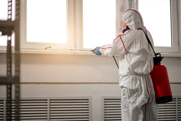 Professional disinfector removing infections — Stock Photo, Image