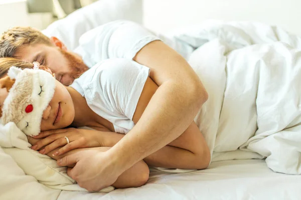 lovely married couple sleep together at home