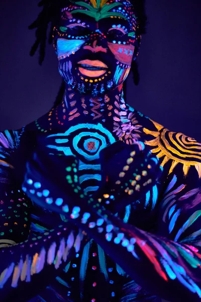 Portrait of man in fluorescent body art — Stock Photo, Image