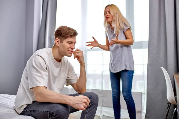 Young man tired of hysterical wife — Stock Photo, Image