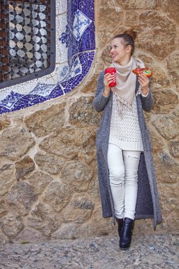 happy traveller woman at Guell Park at Christmas looking aside clipart