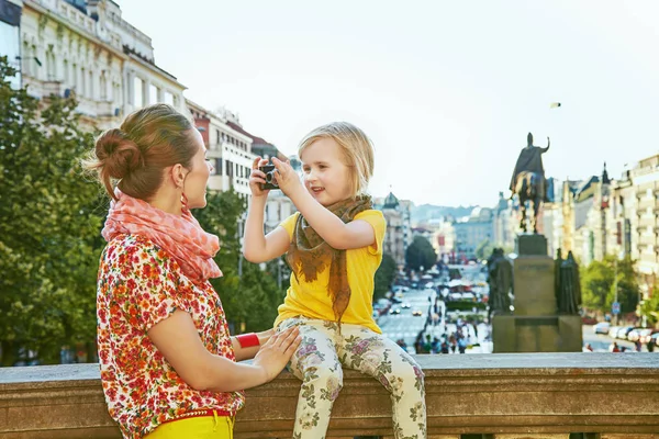 Mother and child with digital camera taking photo in Prague Royalty Free Stock Images