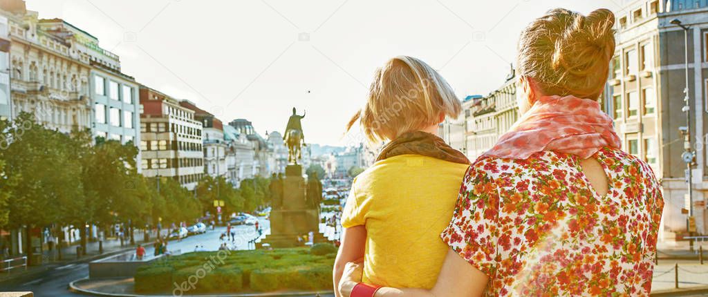 mother and daughter tourists exploring attractions in Prague