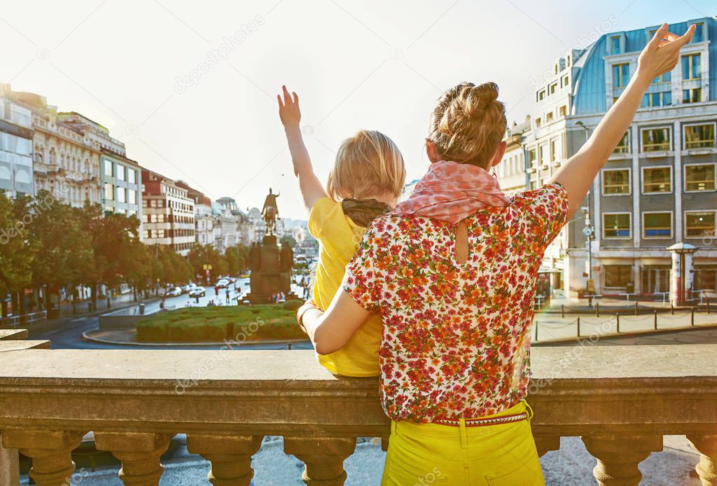 mother and daughter travellers in Prague rejoicing