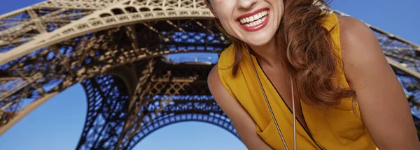 Closeup on smiling young woman in Paris, France