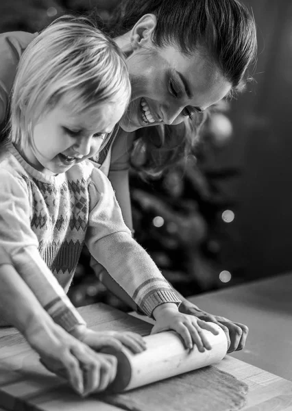 Smiling Mother Baby Rolling Pin Dough Christmas Decorated Kitchen — Stock Photo, Image