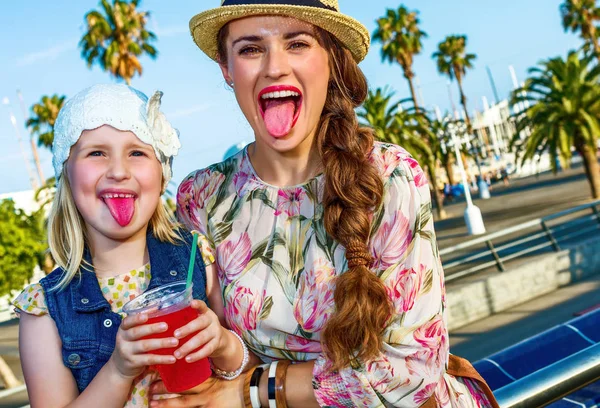 Happy Modern Mother Child Tourists Embankment Barcelona Spain Showing Tongues — Stock Photo, Image